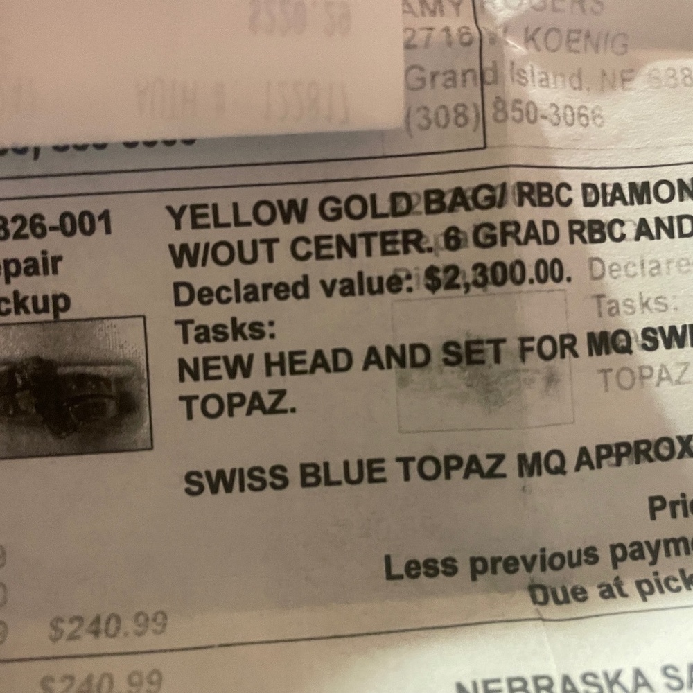 Pure diamond baguettes with blue topaz center.